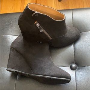 Black wedge ankle booties with zipper detail